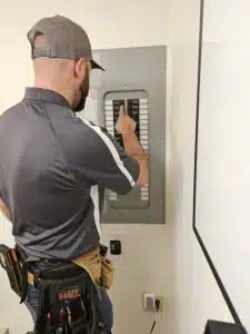 Technician checking panel in Brookfield, CT.